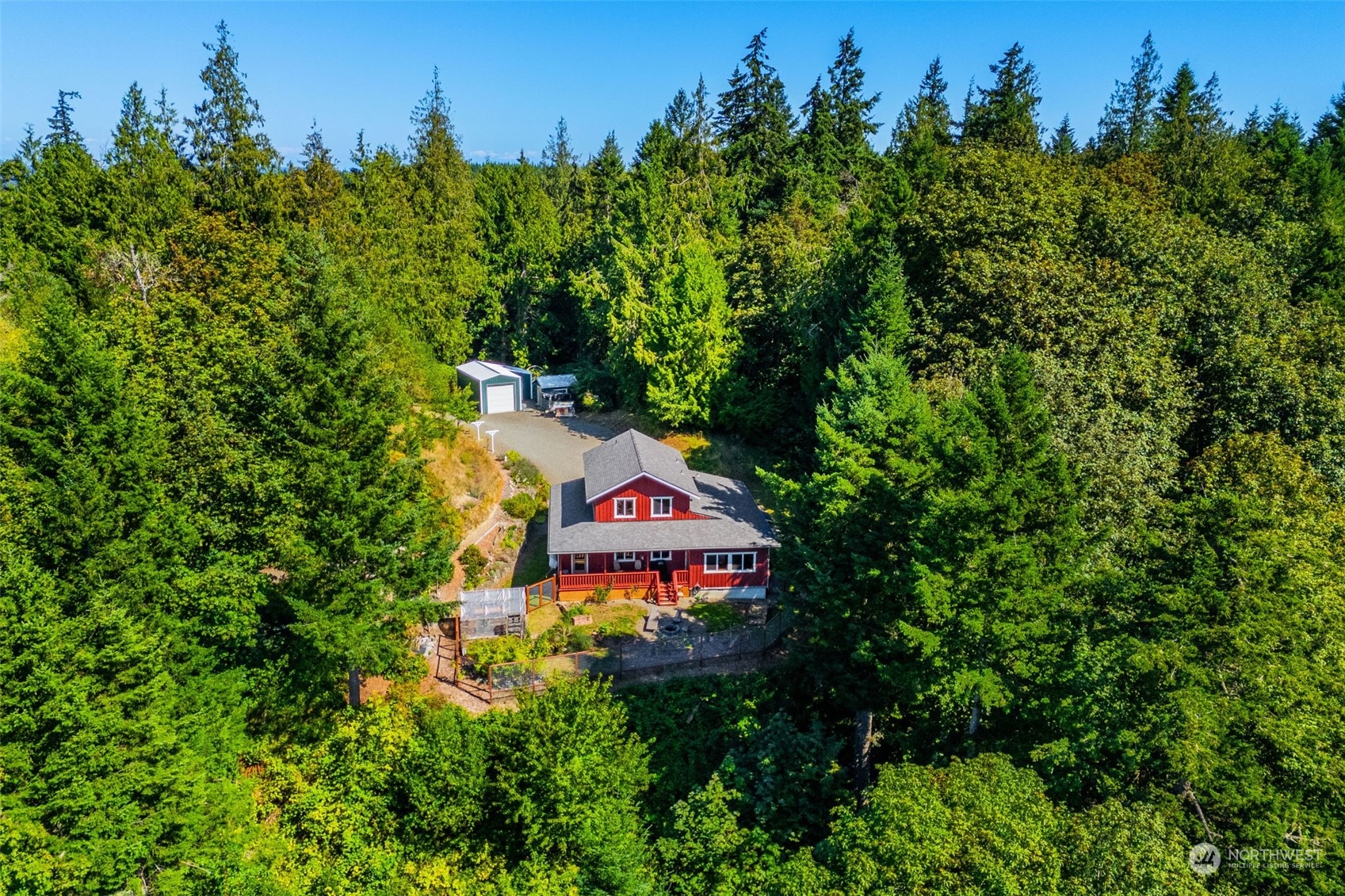 702 Sugar Hill Road Port Hadlock, WA 98339 - Photo 35 of 40 an aerial view of a house with a yard and lake view