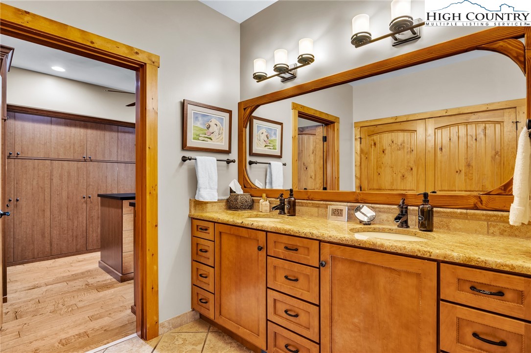2650 Carson Woods Road Laurel Springs, NC 28644 - Photo 22 of 50 a bathroom with a granite countertop sink mirror and