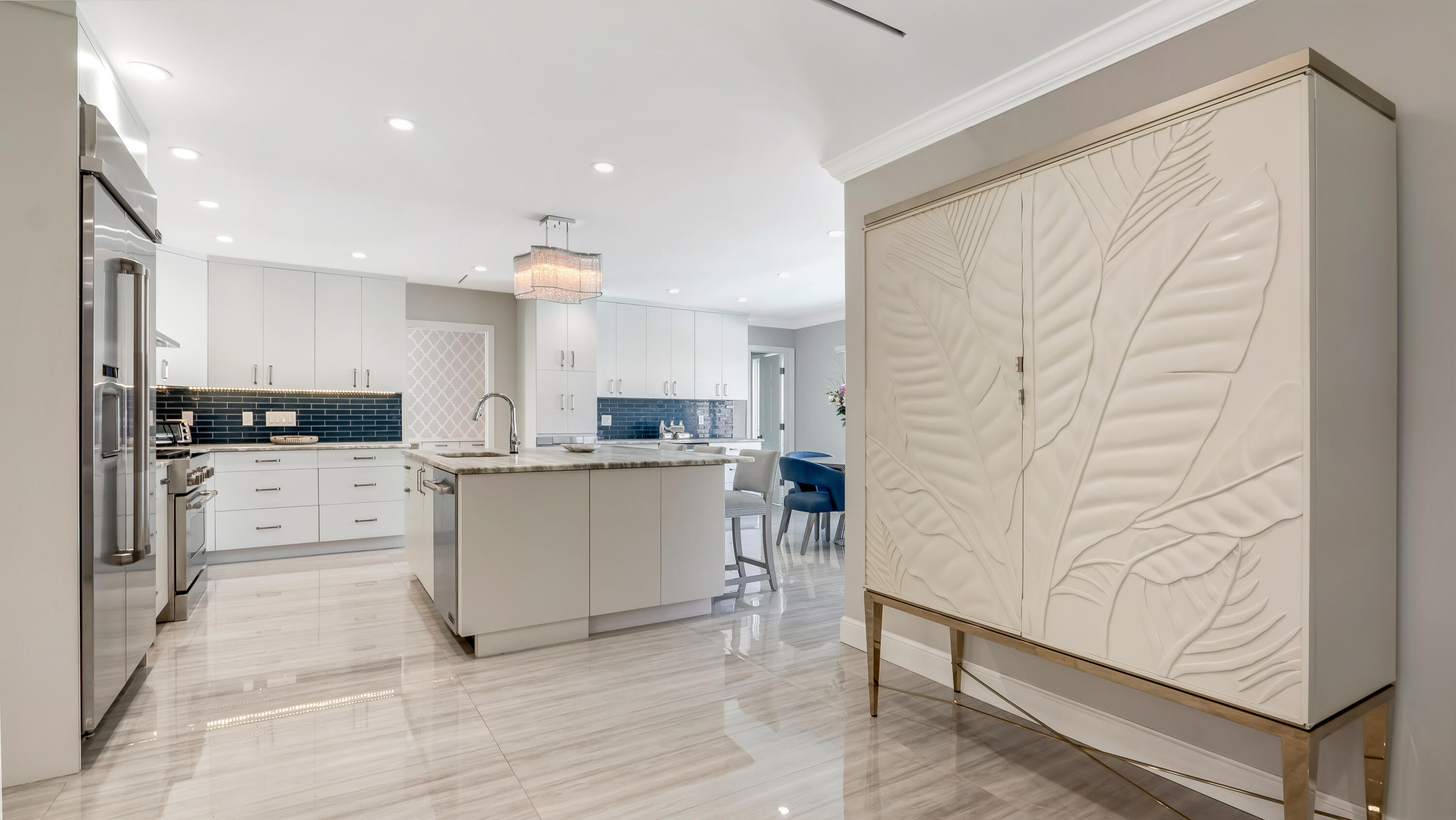 831 Dover Street Boca Raton, FL 33487 - Photo 22 of 71 a kitchen with white cabinets and appliances