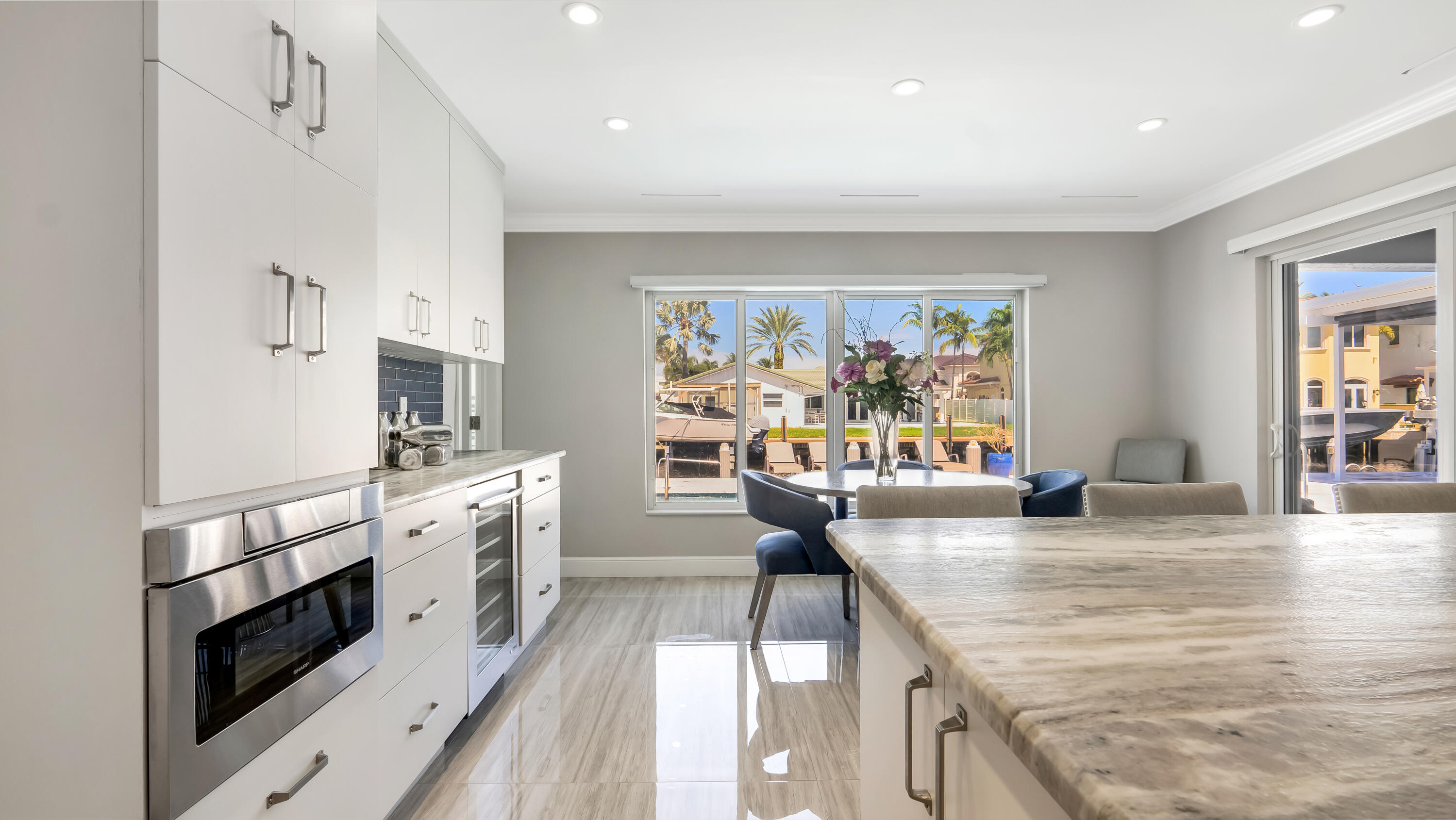 831 Dover Street Boca Raton, FL 33487 - Photo 27 of 71 a kitchen with stainless steel appliances granite countertop a stove and a refrigerator