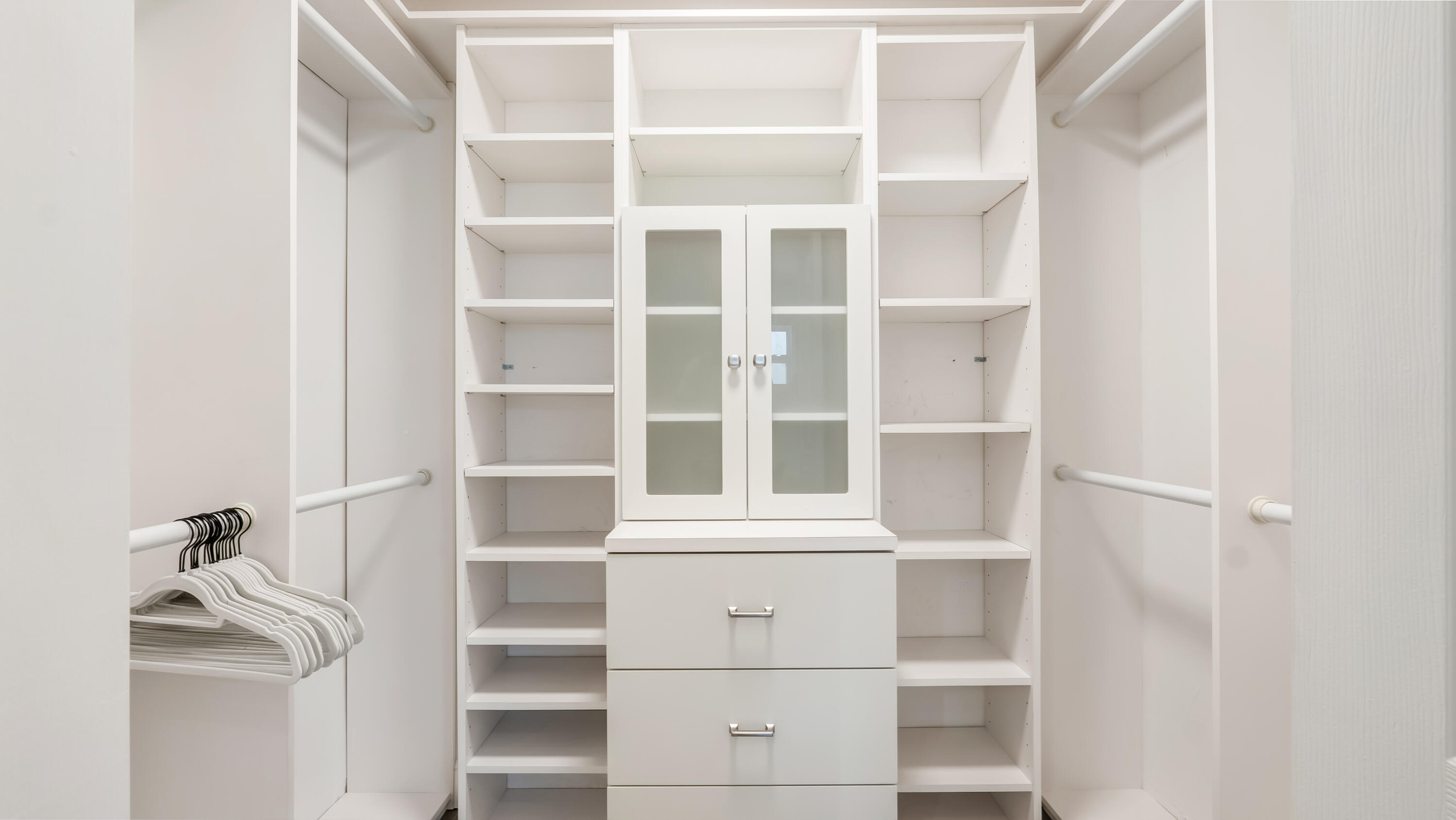 831 Dover Street Boca Raton, FL 33487 - Photo 54 of 71 a view of walk in closet with empty racks