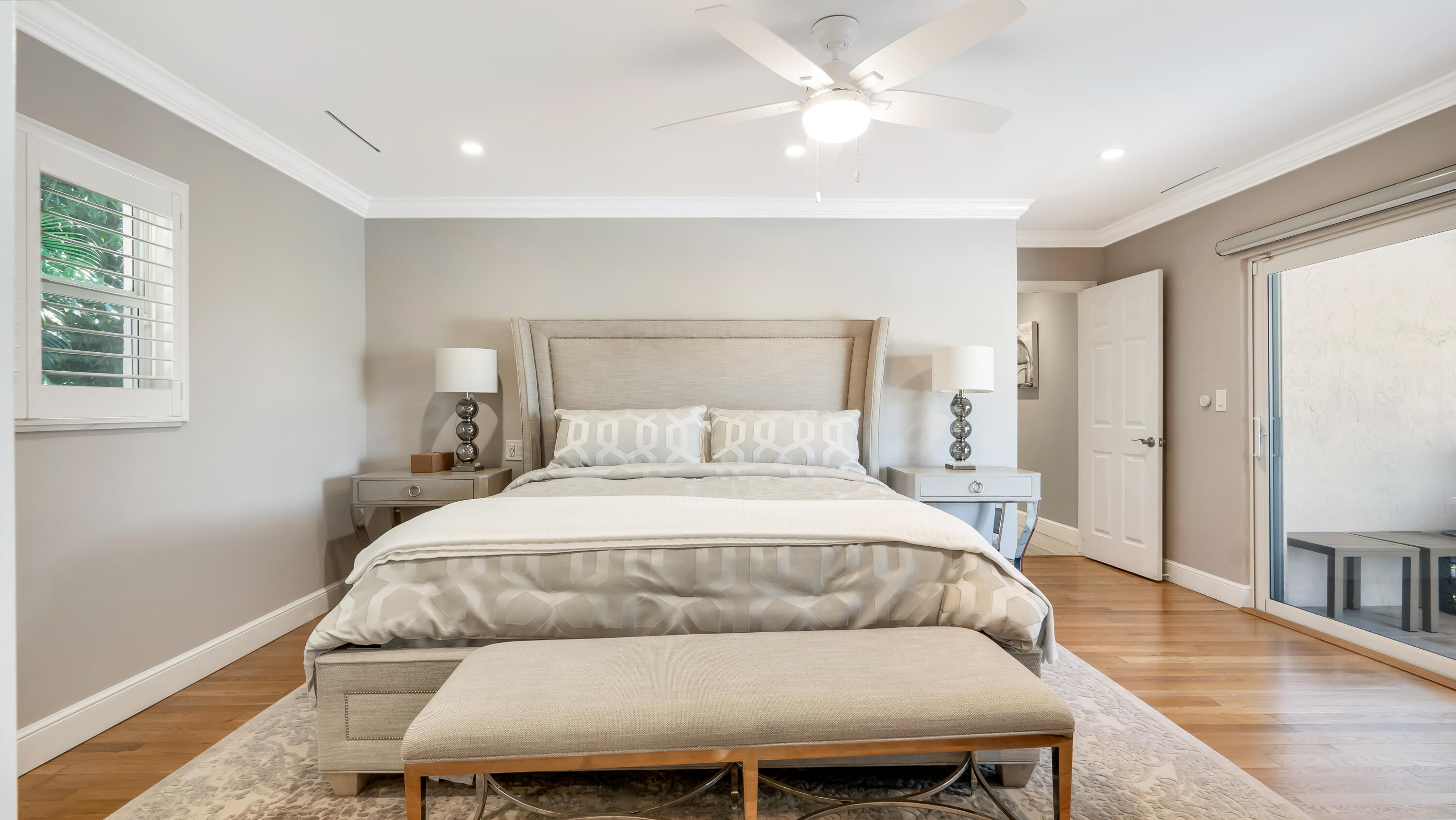 831 Dover Street Boca Raton, FL 33487 - Photo 55 of 71 a bedroom with a bed and wooden floor