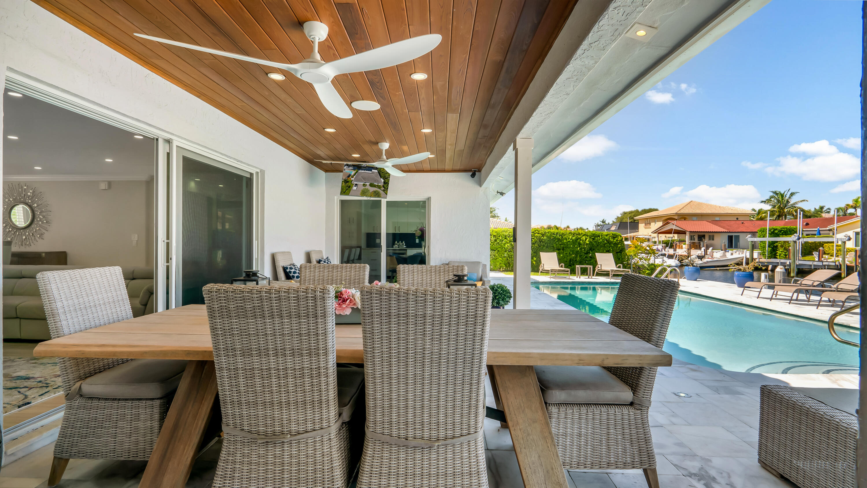 831 Dover Street Boca Raton, FL 33487 - Photo 57 of 71 a dining room with furniture and a floor to ceiling window