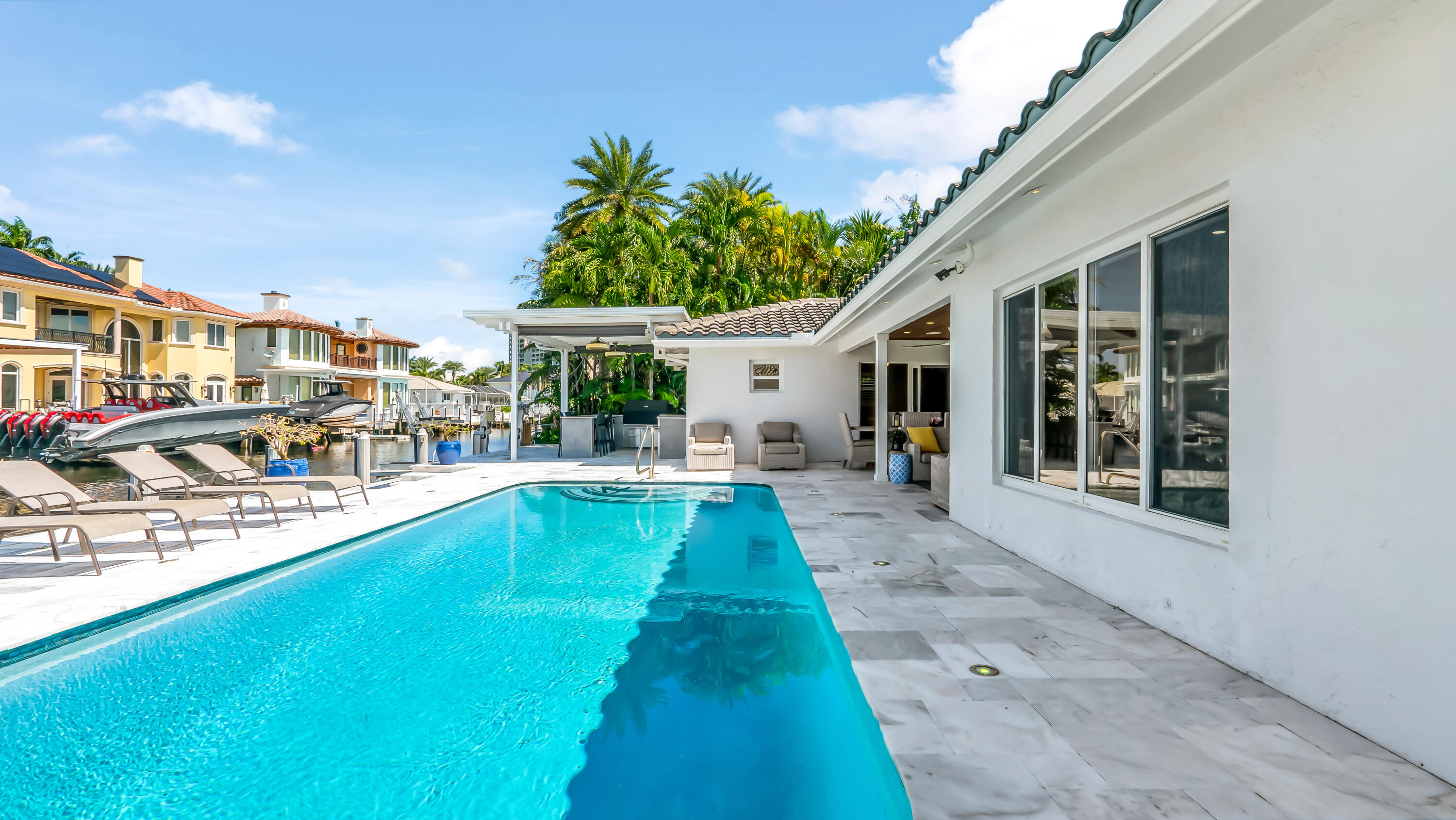 831 Dover Street Boca Raton, FL 33487 - Photo 70 of 71 a view of a house with swimming pool and sitting area