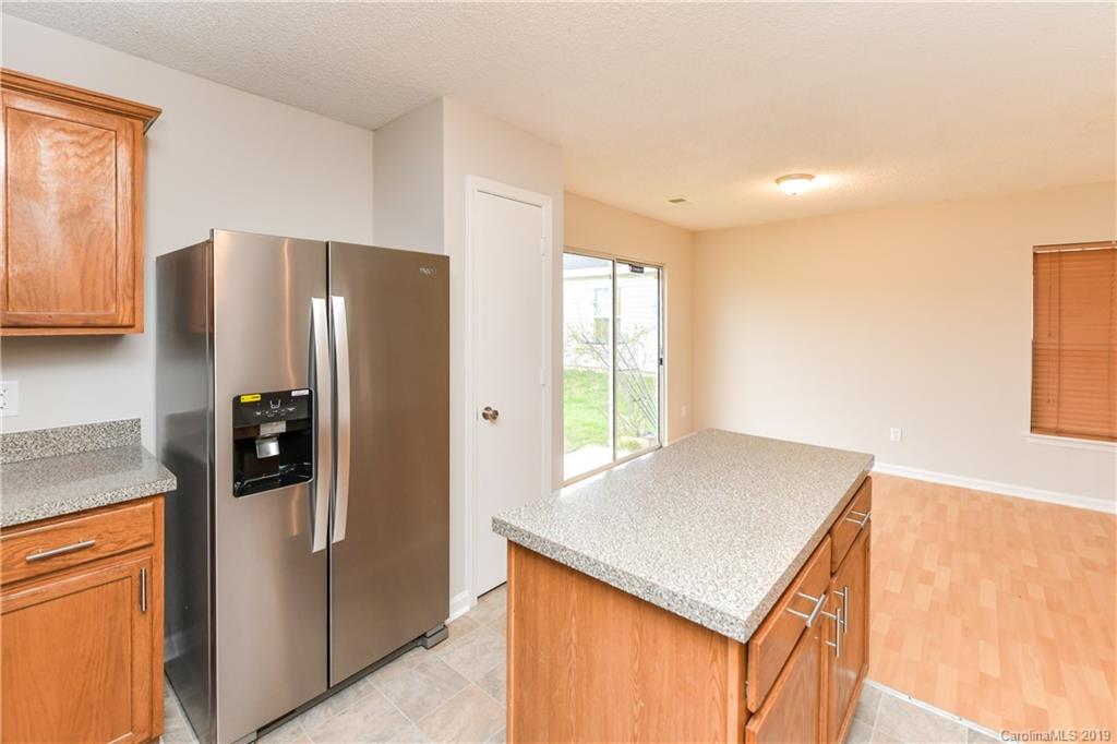 2031 Pimpernel Road Charlotte, NC 28213 - Photo 12 of 25 a kitchen with stainless steel appliances granite countertop a refrigerator and a stove