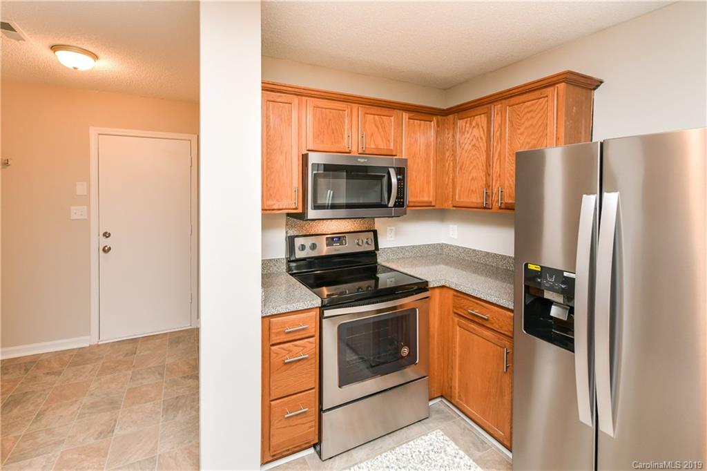 2031 Pimpernel Road Charlotte, NC 28213 - Photo 14 of 25 a kitchen with a refrigerator stove and microwave