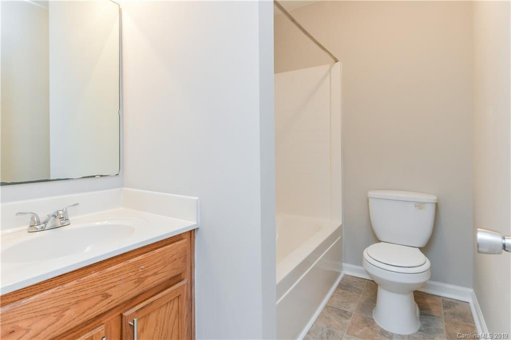 2031 Pimpernel Road Charlotte, NC 28213 - Photo 21 of 25 a bathroom with a toilet sink and mirror