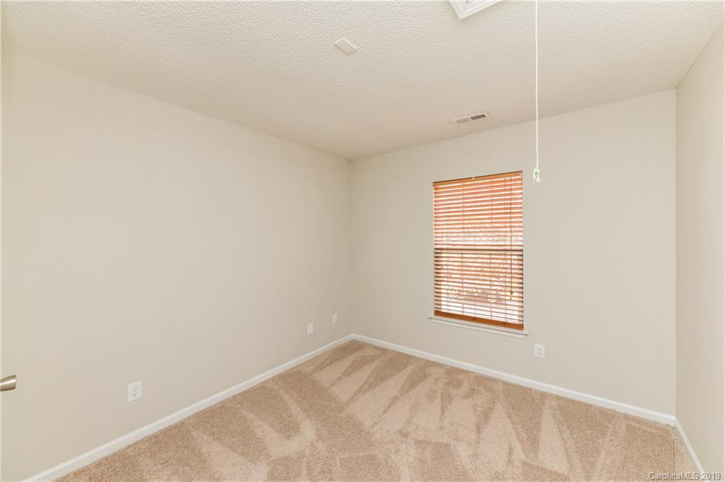 2031 Pimpernel Road Charlotte, NC 28213 - Photo 23 of 25 a view of an empty room with a window