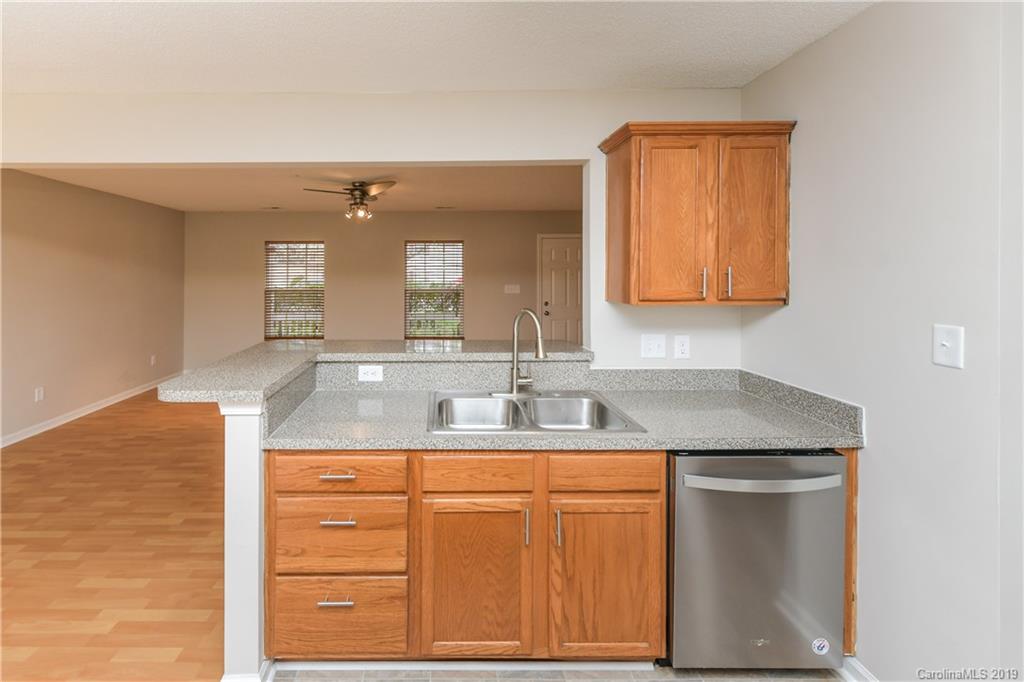 2031 Pimpernel Road Charlotte, NC 28213 - Photo 9 of 25 a bathroom with a granite countertop sink and a mirror