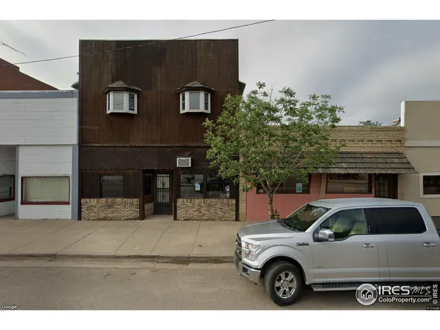 a view of a car parked in front of a house