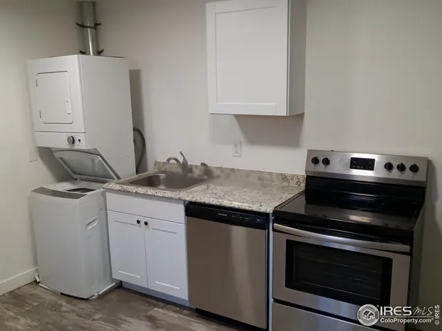 a kitchen with a stove and a microwave