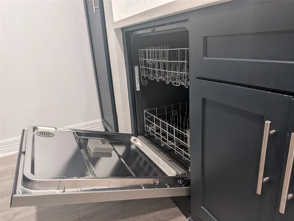 a bathroom with a toilet a sink a shower and mirror