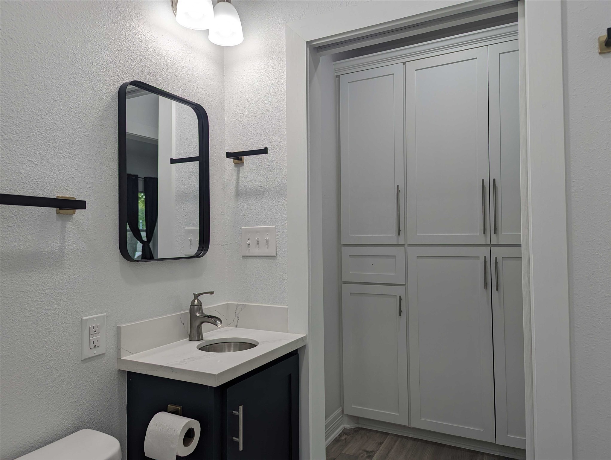 4711 Rusk Street, Unit A Houston, TX 77023 - Photo 15 of 19 a bathroom with a sink and a mirror
