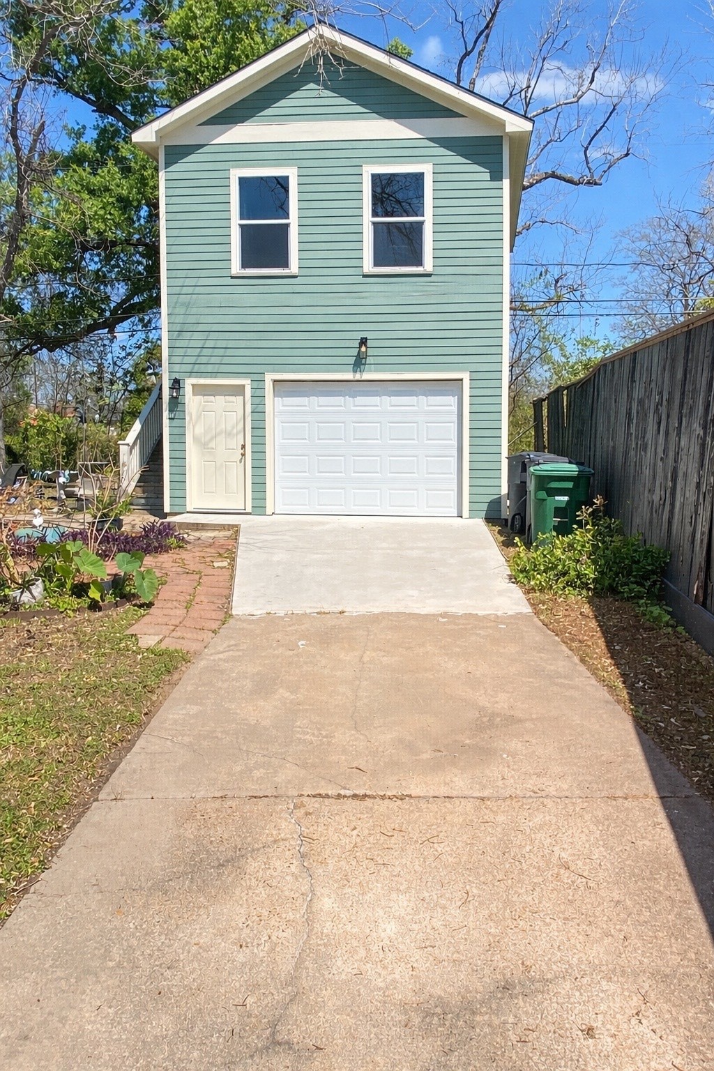 4711 Rusk Street, Unit A Houston, TX 77023 - Photo 19 of 19 a front view of a house with a yard and garage