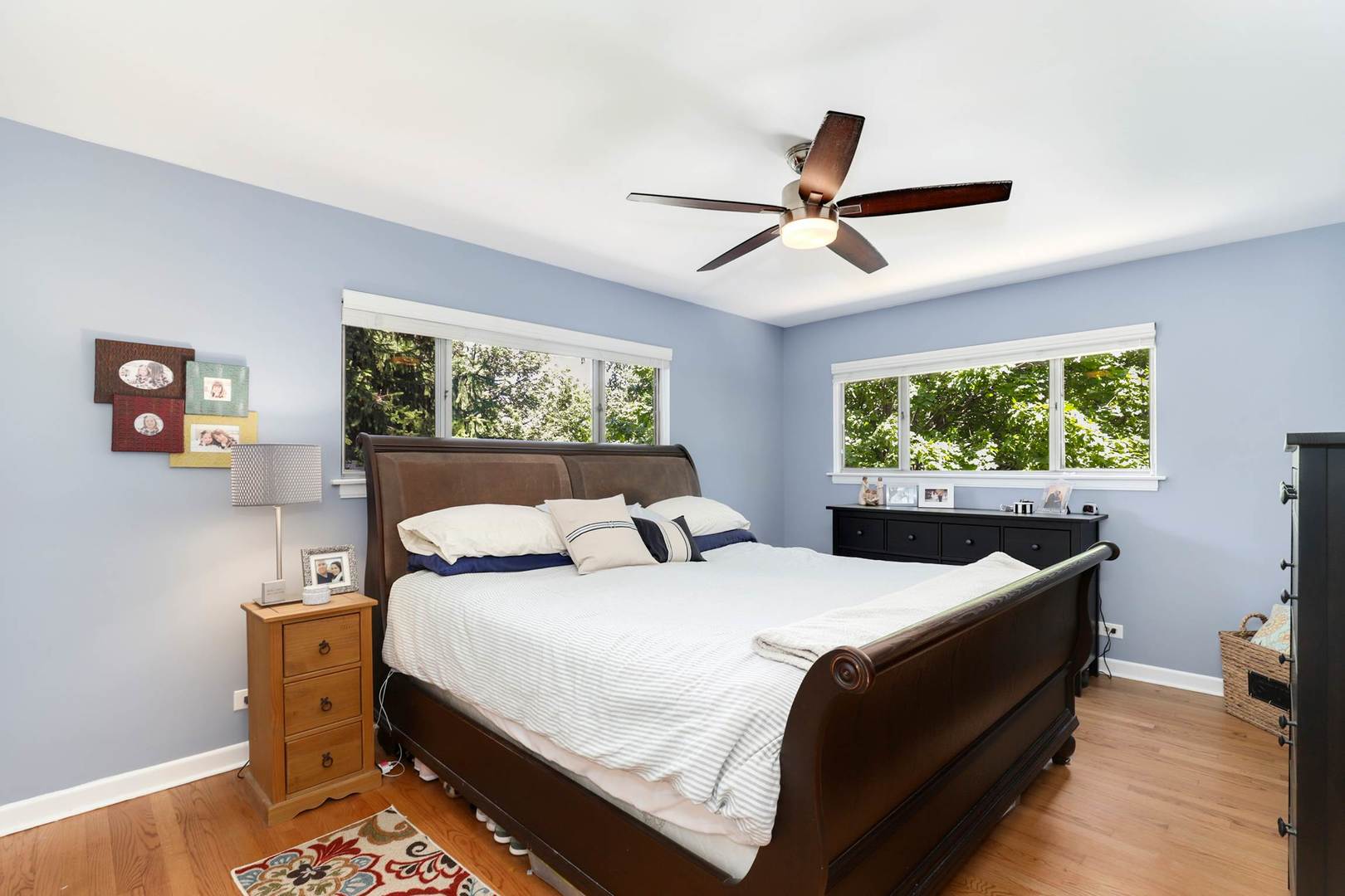 3906 Wolf Road Western Springs, IL 60558 - Photo 18 of 33 a bedroom with a bed and a chandelier