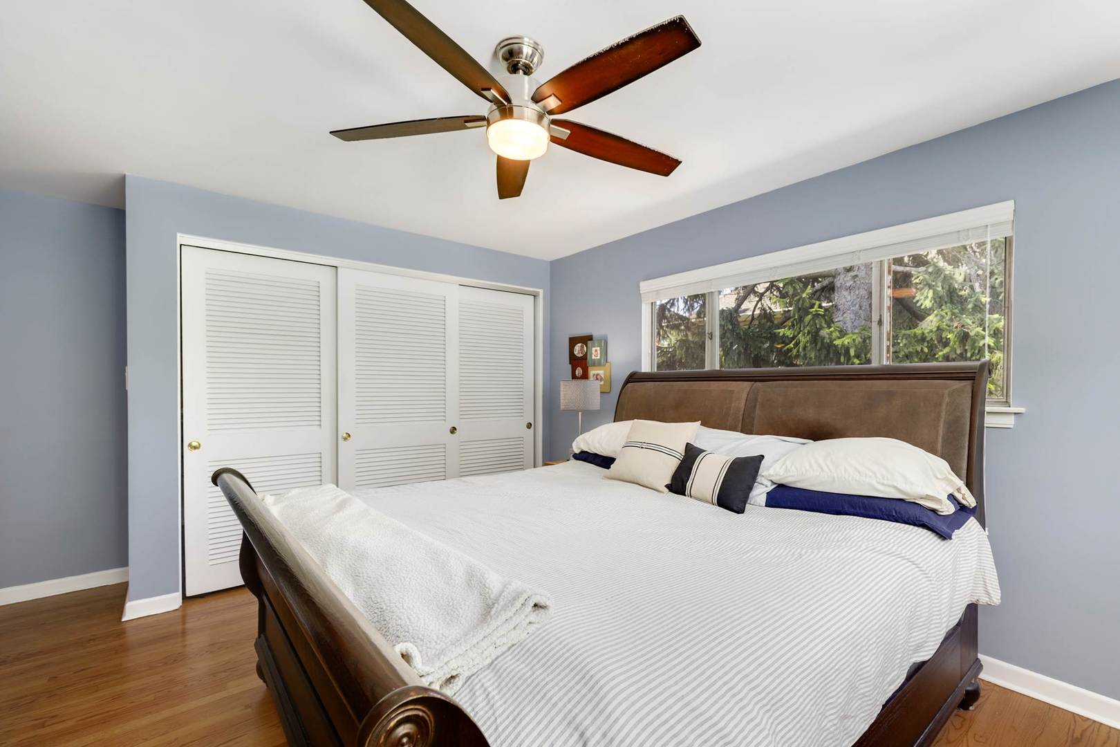 3906 Wolf Road Western Springs, IL 60558 - Photo 19 of 33 a bedroom with a large bed and a large window