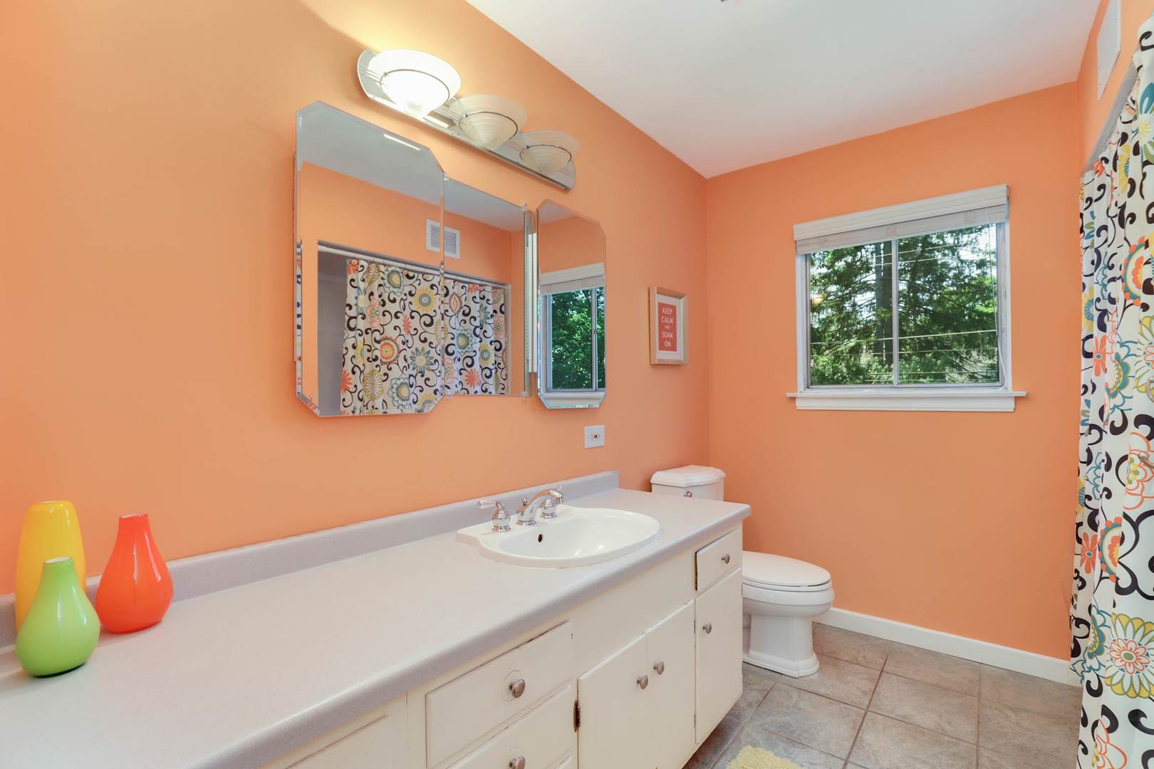 3906 Wolf Road Western Springs, IL 60558 - Photo 20 of 33 a bathroom with a toilet sink and mirror