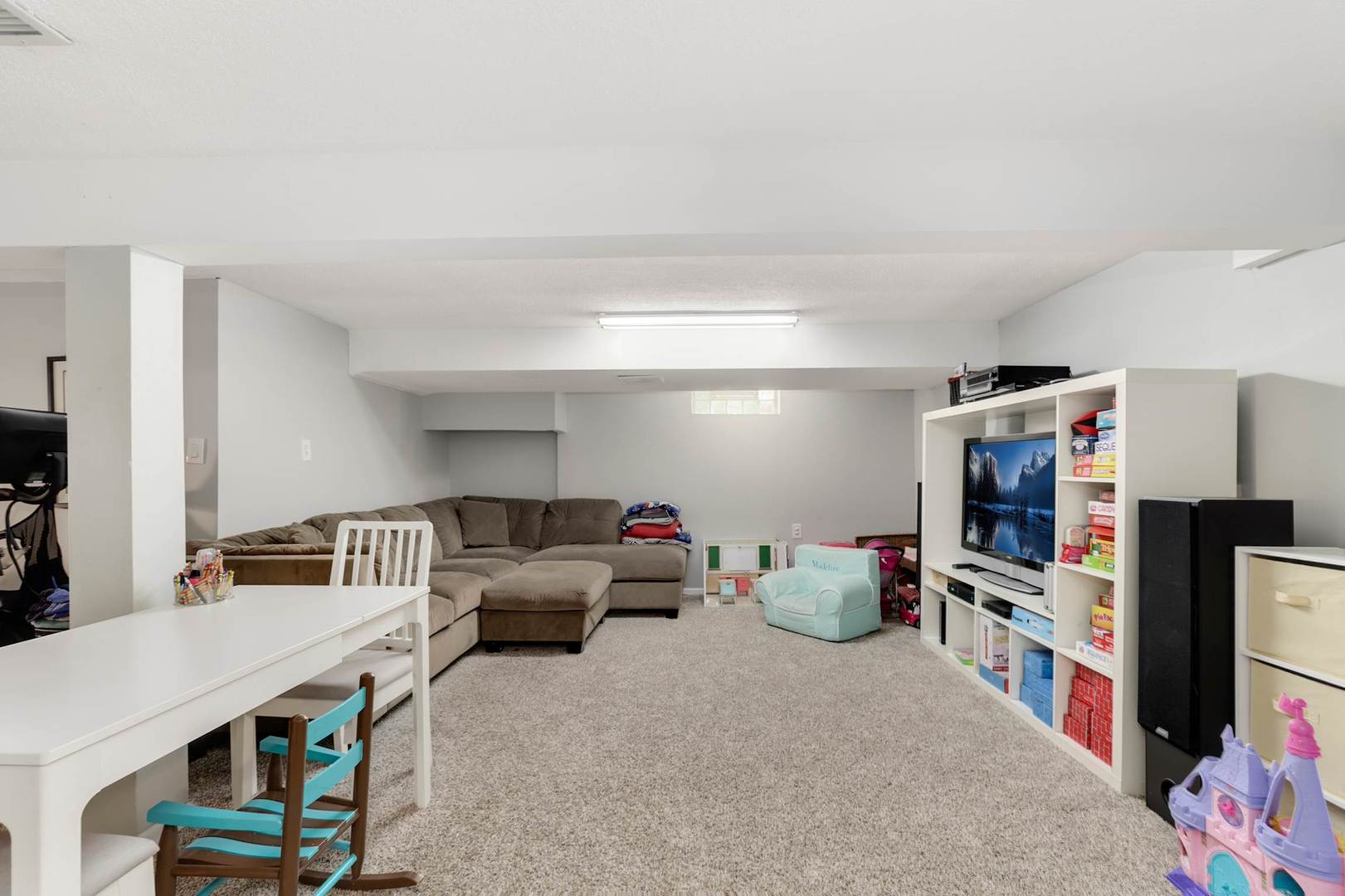 3906 Wolf Road Western Springs, IL 60558 - Photo 22 of 33 a living room with furniture and a flat screen tv