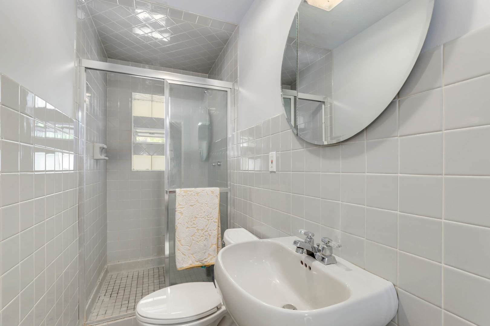 3906 Wolf Road Western Springs, IL 60558 - Photo 26 of 33 a bathroom with a sink a toilet and a mirror
