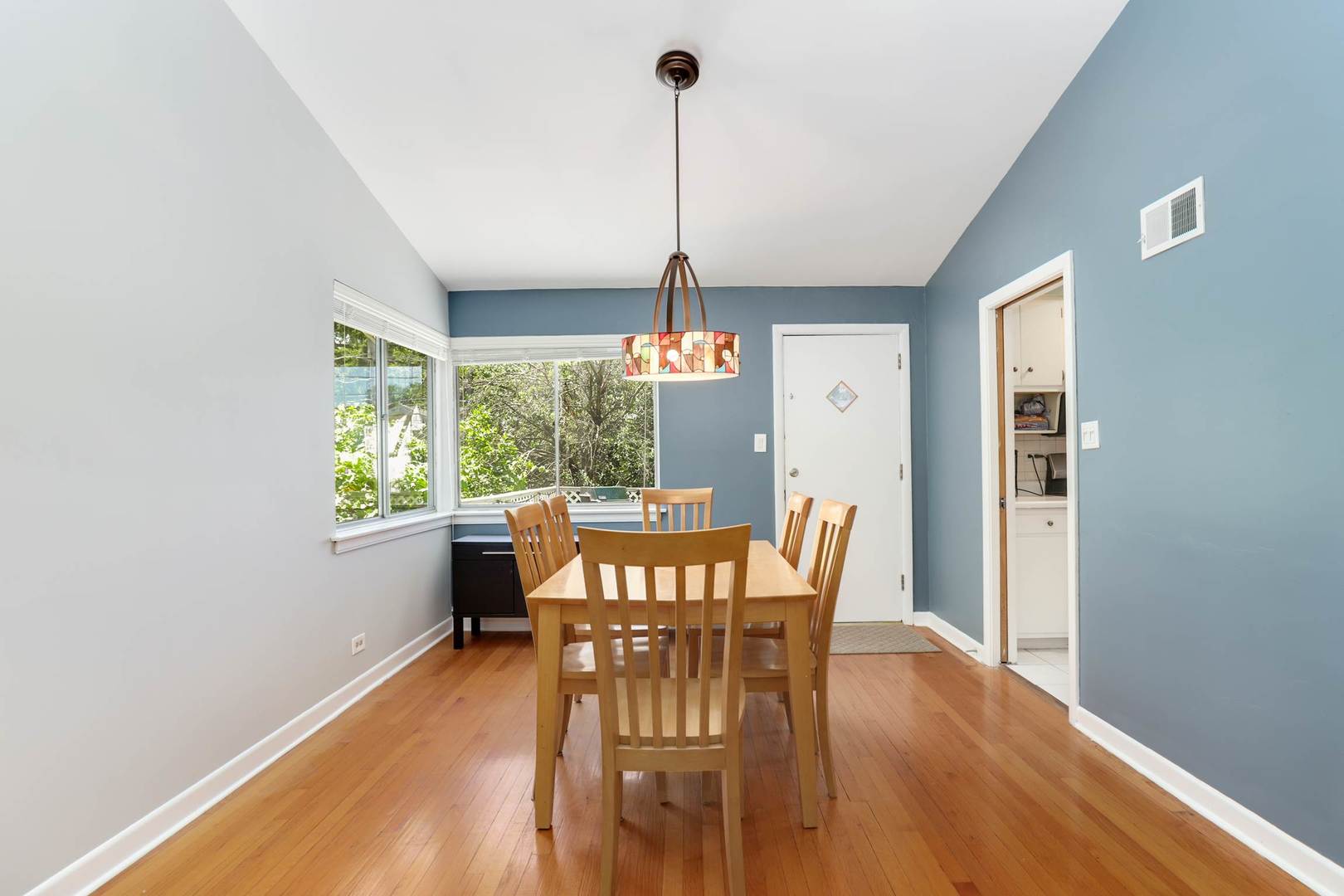 3906 Wolf Road Western Springs, IL 60558 - Photo 9 of 33 a view of a dining room with furniture window and wooden floor