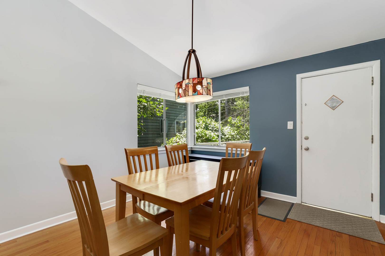 3906 Wolf Road Western Springs, IL 60558 - Photo 10 of 33 a dining room with furniture a chandelier and wooden floor