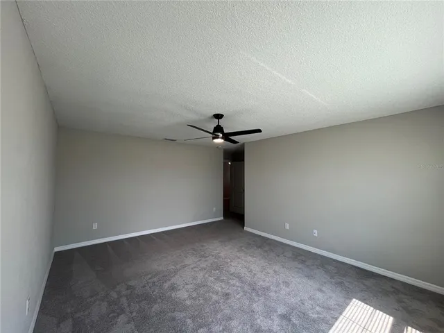a bathroom with a granite countertop sink mirror and shower