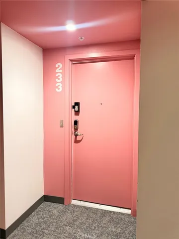 a large kitchen with a table and chairs