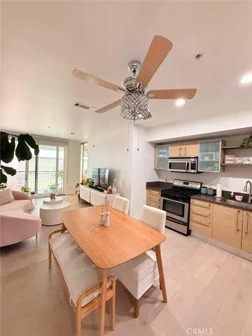 a kitchen with stainless steel appliances granite countertop a stove and a refrigerator