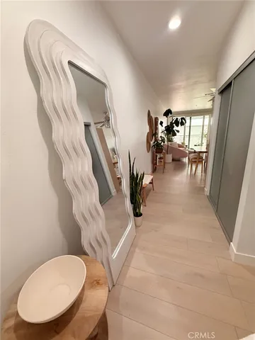 a bedroom with a bed and a mirror