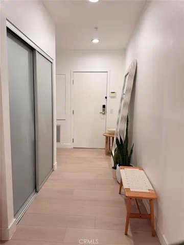 a balcony with table and chairs