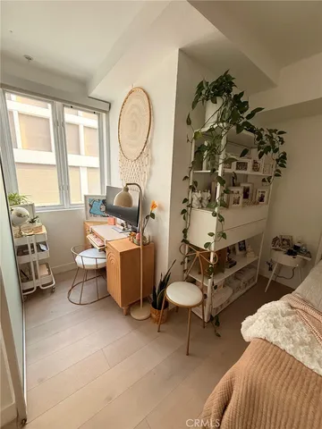 a vase of flowers sitting on a floor