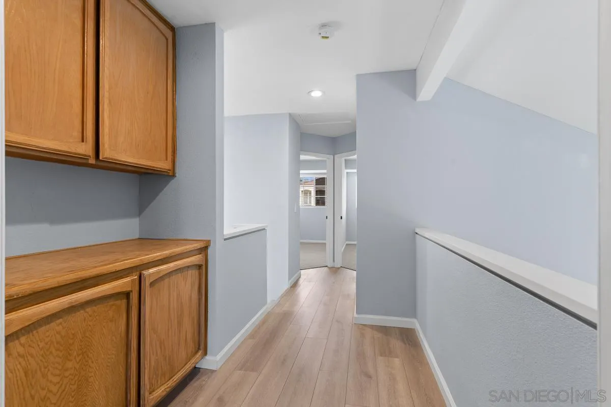 13948 Carmel Ridge Road San Diego, CA 92128 - Photo 15 of 26 a view of hallway with wooden floor