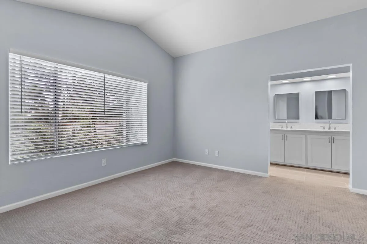 13948 Carmel Ridge Road San Diego, CA 92128 - Photo 16 of 26 a view of an empty room with a window