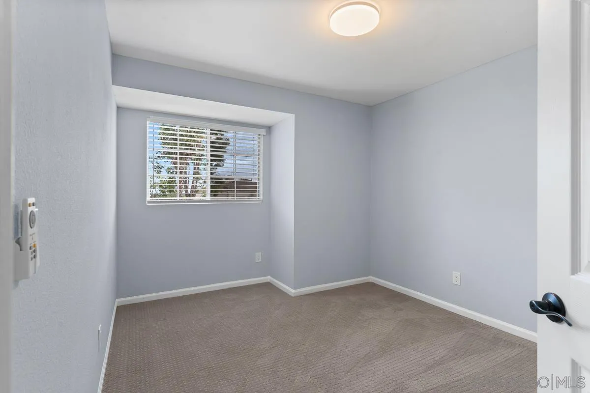 13948 Carmel Ridge Road San Diego, CA 92128 - Photo 22 of 26 a view of an empty room with a window