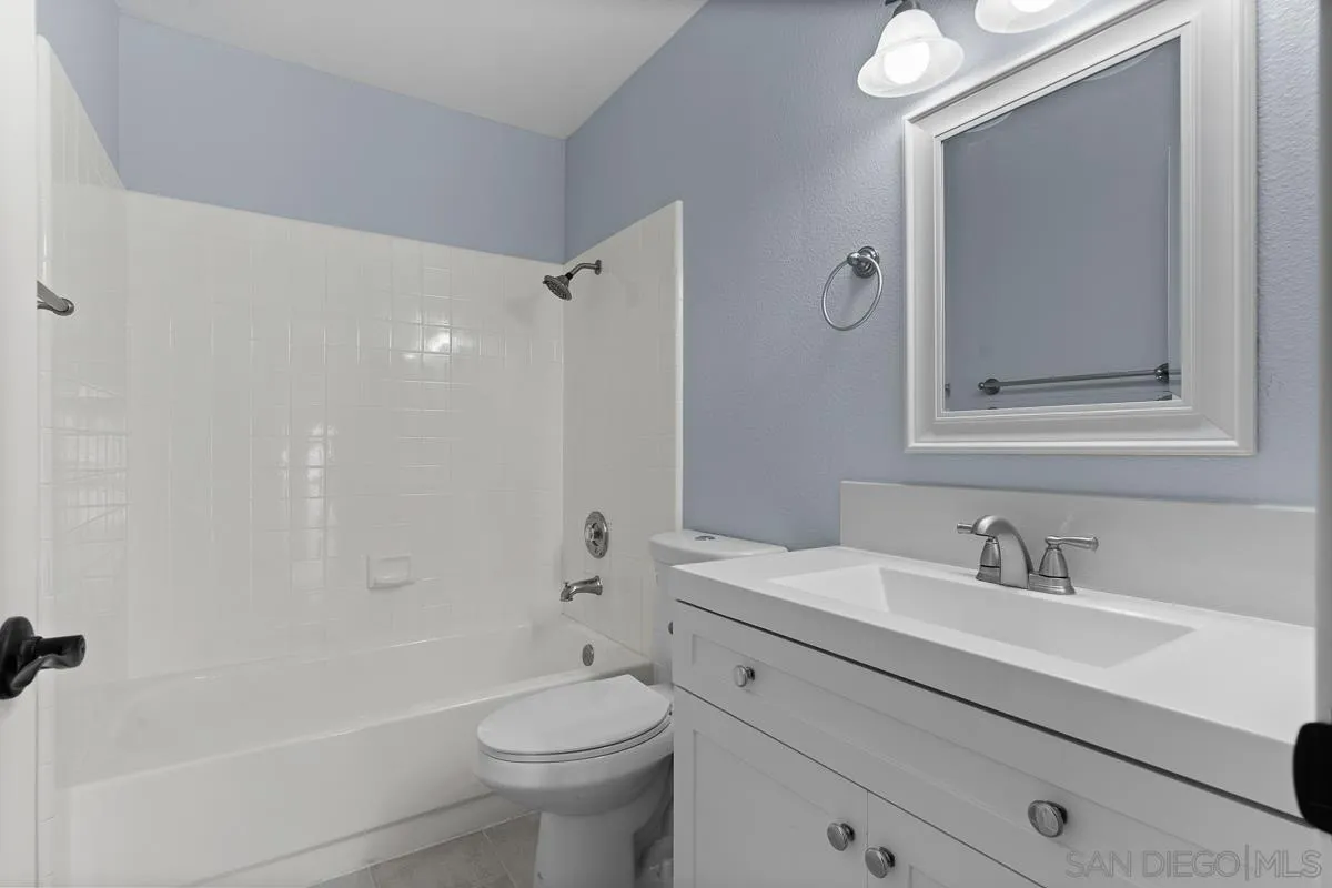 13948 Carmel Ridge Road San Diego, CA 92128 - Photo 23 of 26 a bathroom with a sink a toilet and shower