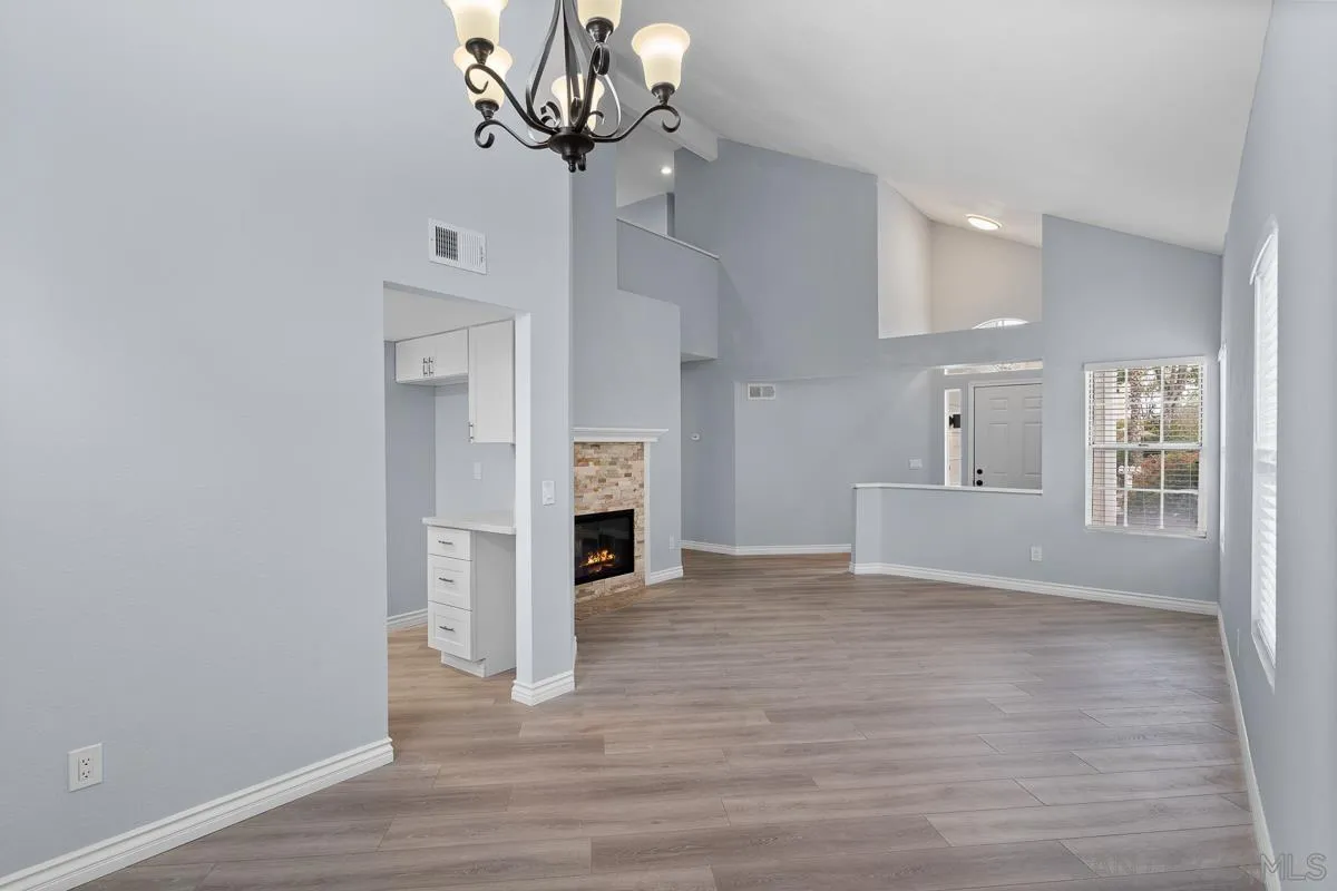 13948 Carmel Ridge Road San Diego, CA 92128 - Photo 5 of 26 a view of a livingroom with a chandelier