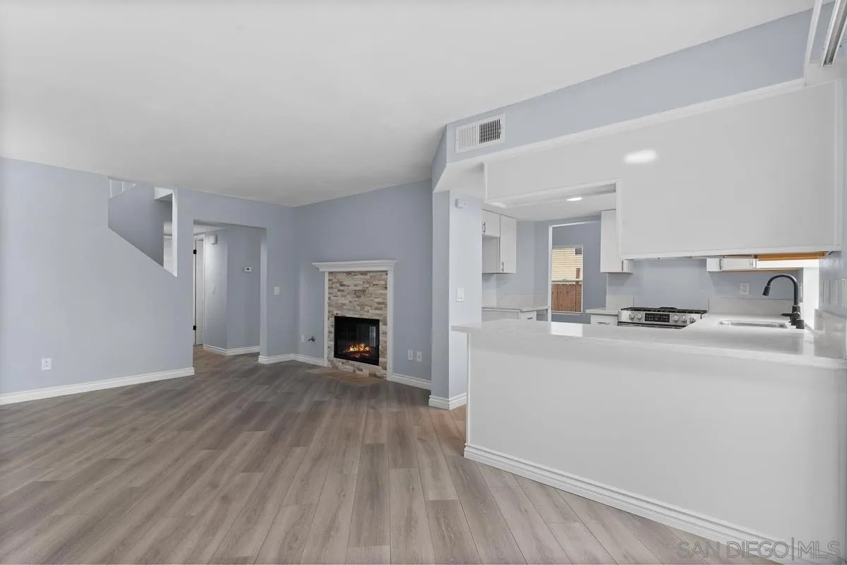 13948 Carmel Ridge Road San Diego, CA 92128 - Photo 9 of 26 a view of kitchen with sink and fireplace