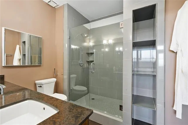 a bathroom with a sink double vanity and a mirror