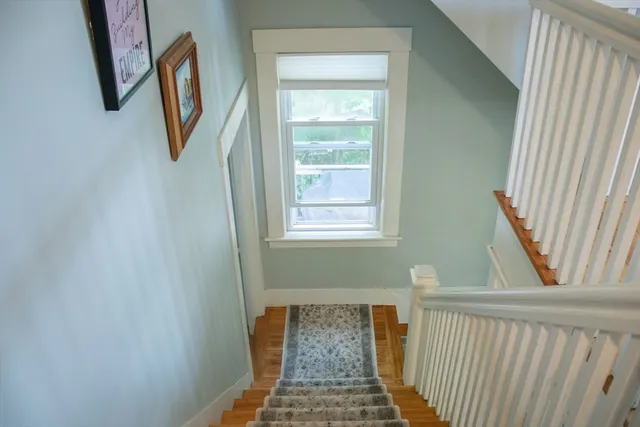 a view of a hallway with windows