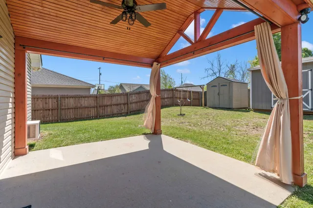 a view of backyard with green space