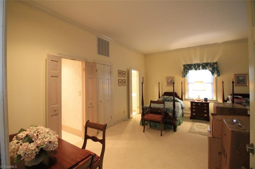 1415 Heathcliff Road High Point, NC 27262 - Photo 22 of 29 Walk thru the carport to find a great Guest Quarters or In-Law Suite with built-in bookshelves large enough to hold a TV.