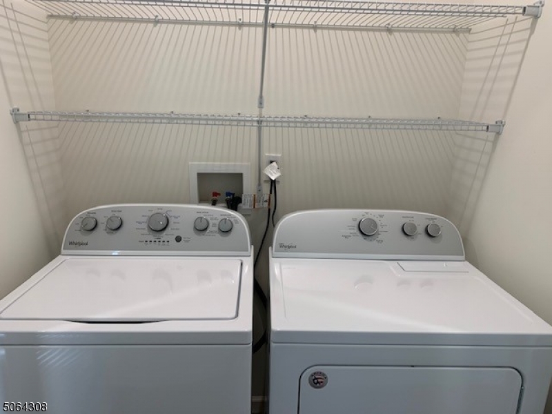 60 Passaic Avenue, Unit 20 Fairfield, NJ 07004 - Photo 12 of 13 a utility room with dryer and washer