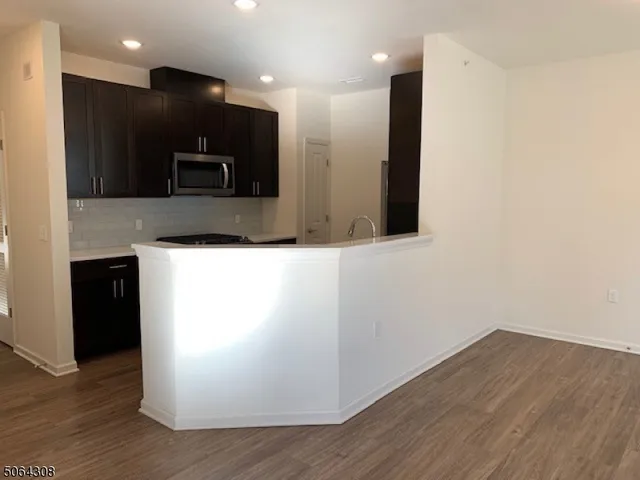 a view of a kitchen with a sink and a microwave