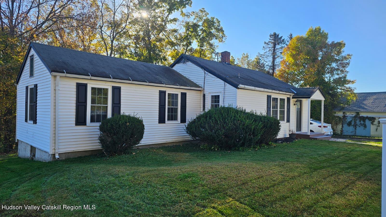 10370 Highway 22 Hillsdale, NY 12529 - Photo 1 of 7 a view of a house with a yard and porch