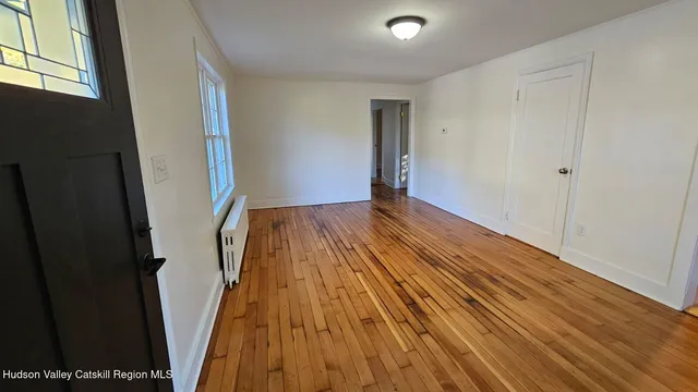a view of entryway with wooden floor