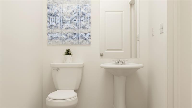 59 Constitution Avenue Pendergrass, GA 30567 - Photo 12 of 27 a bathroom with a sink a toilet and mirror