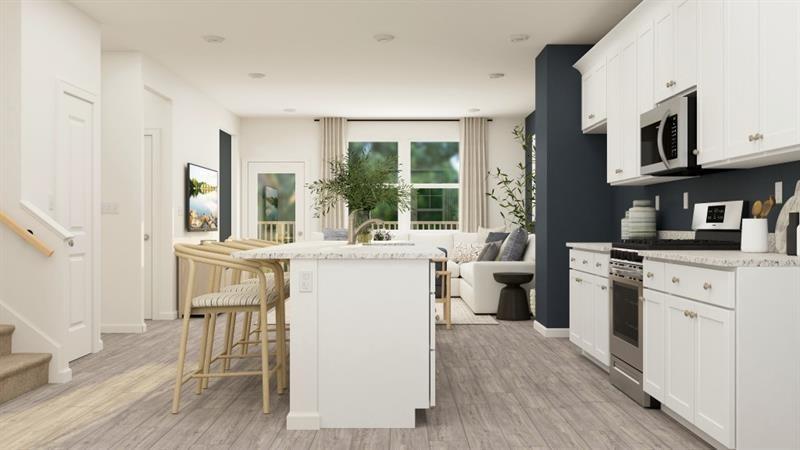 59 Constitution Avenue Pendergrass, GA 30567 - Photo 7 of 27 a kitchen with sink cabinets and wooden floor