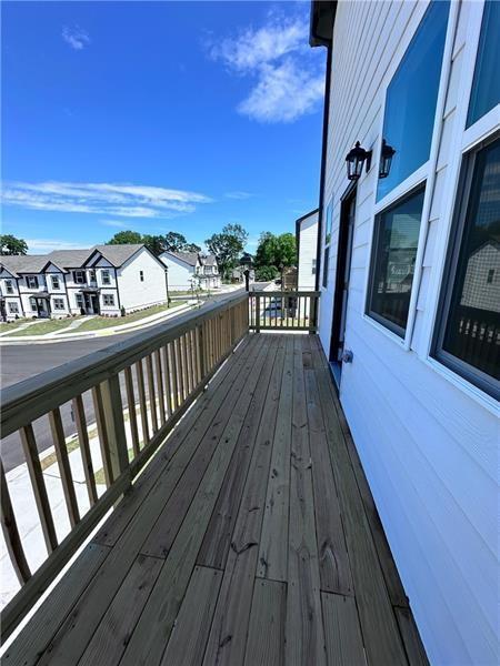 59 Constitution Avenue Pendergrass, GA 30567 - Photo 9 of 27 a view of balcony with wooden floor