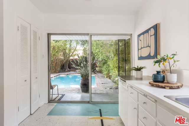 a hallway with a view of living room