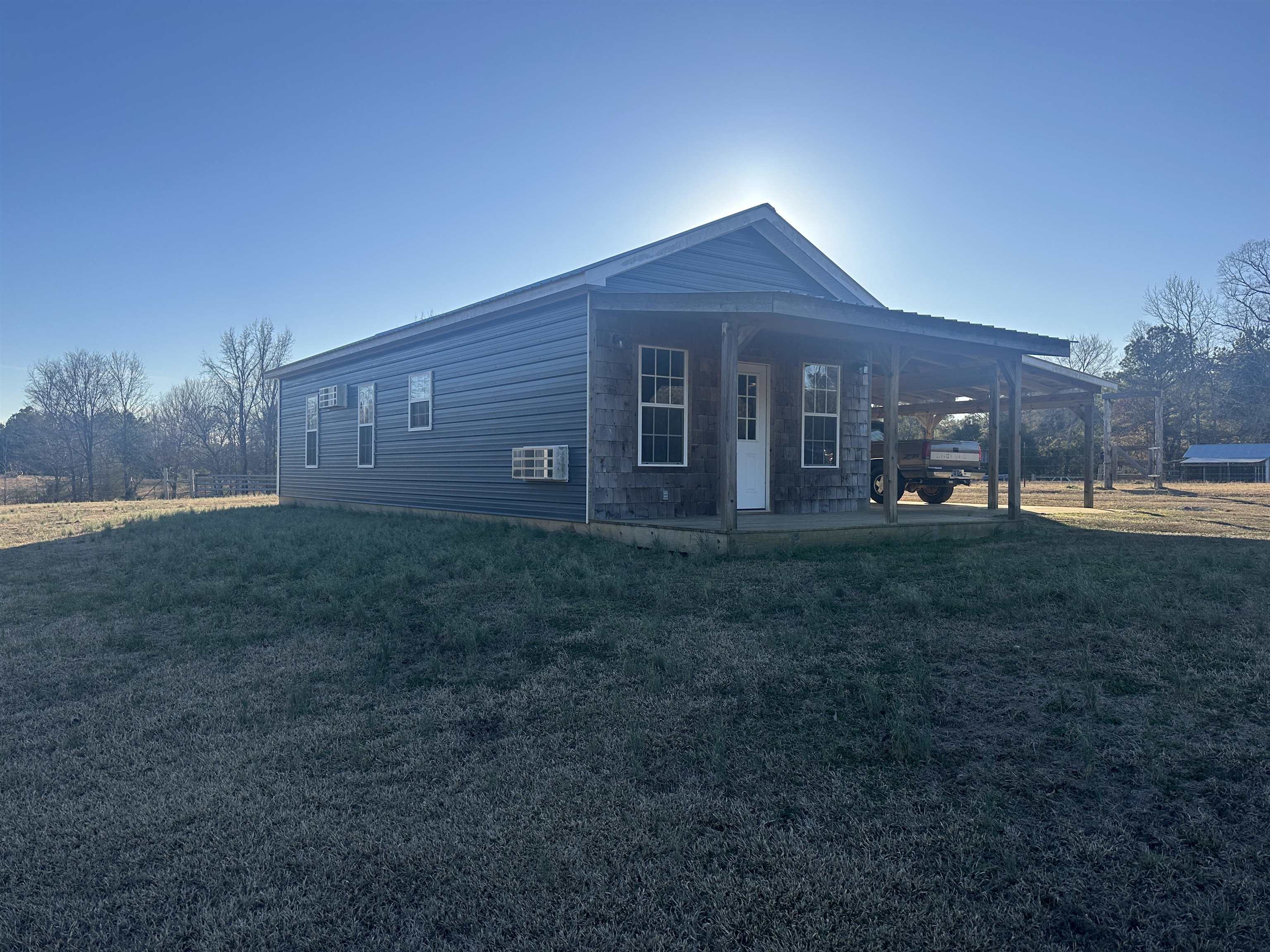 2245 Fritton Spur Road Middleton, TN 38052 - Photo 1 of 24 View of home's exterior with a porch and a yard